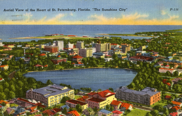 A vintage postcard showing a drawing of St. Petersburg, Florida with the words "Aerial view of the heart of St. Petersburg, Florida. 'The Sunshine City'"
